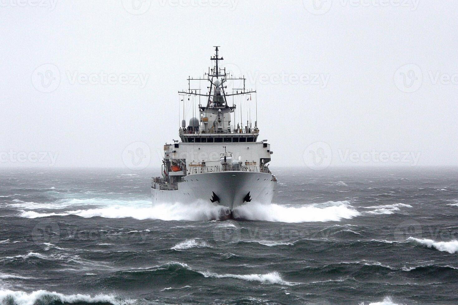 A large ship traveling through rough water photo