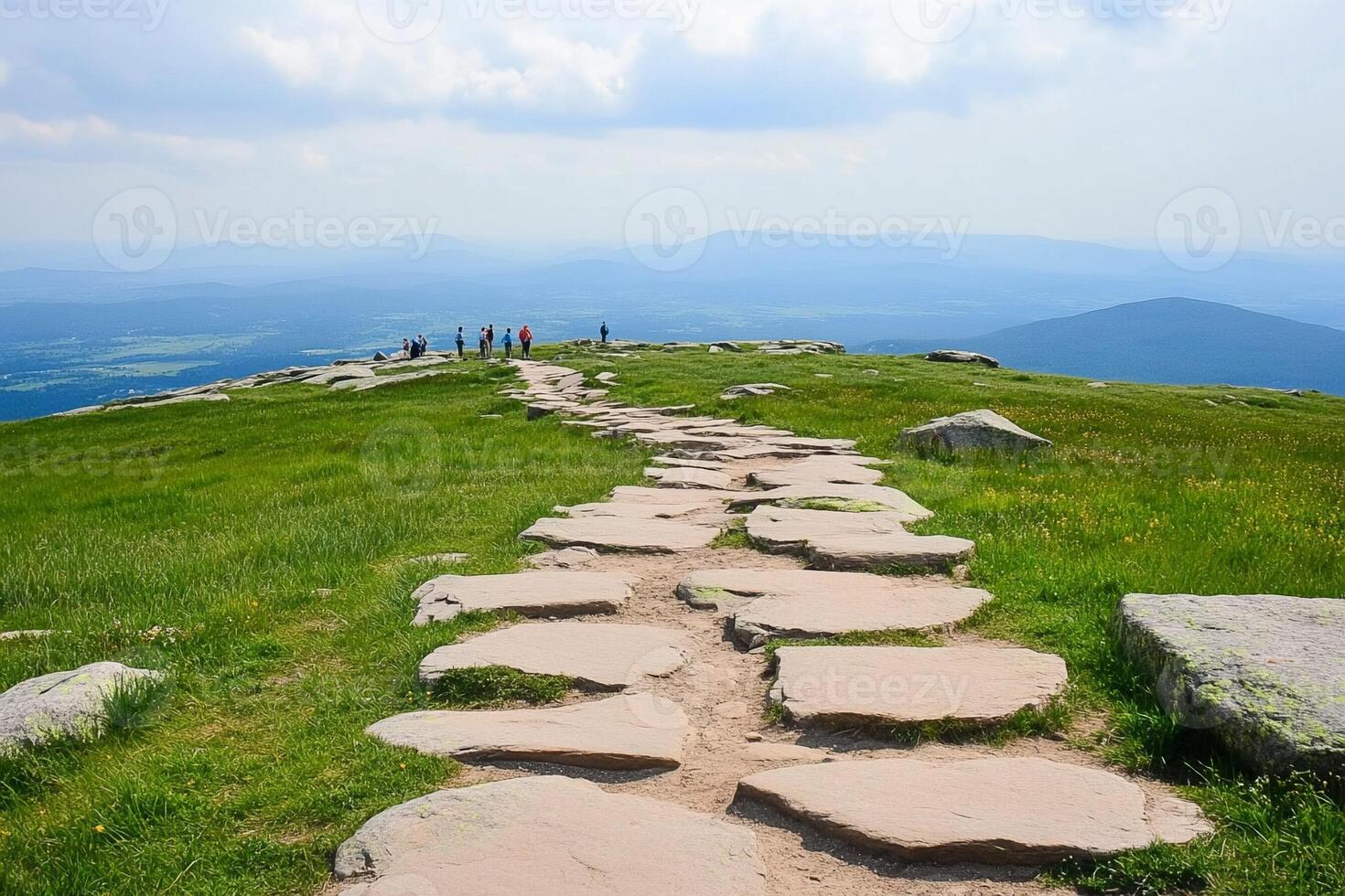Steep stone path leading to the top of a mountain photo