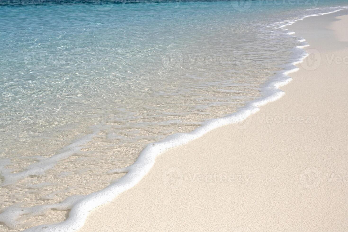 A sandy beach with a clear ocean and a white sand photo