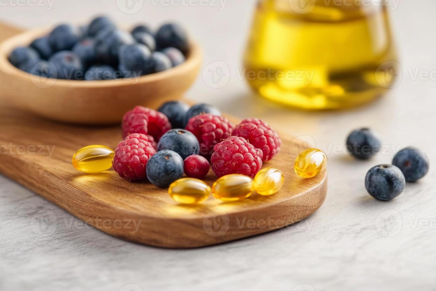 Berries and vitamin supplements on a wooden board photo