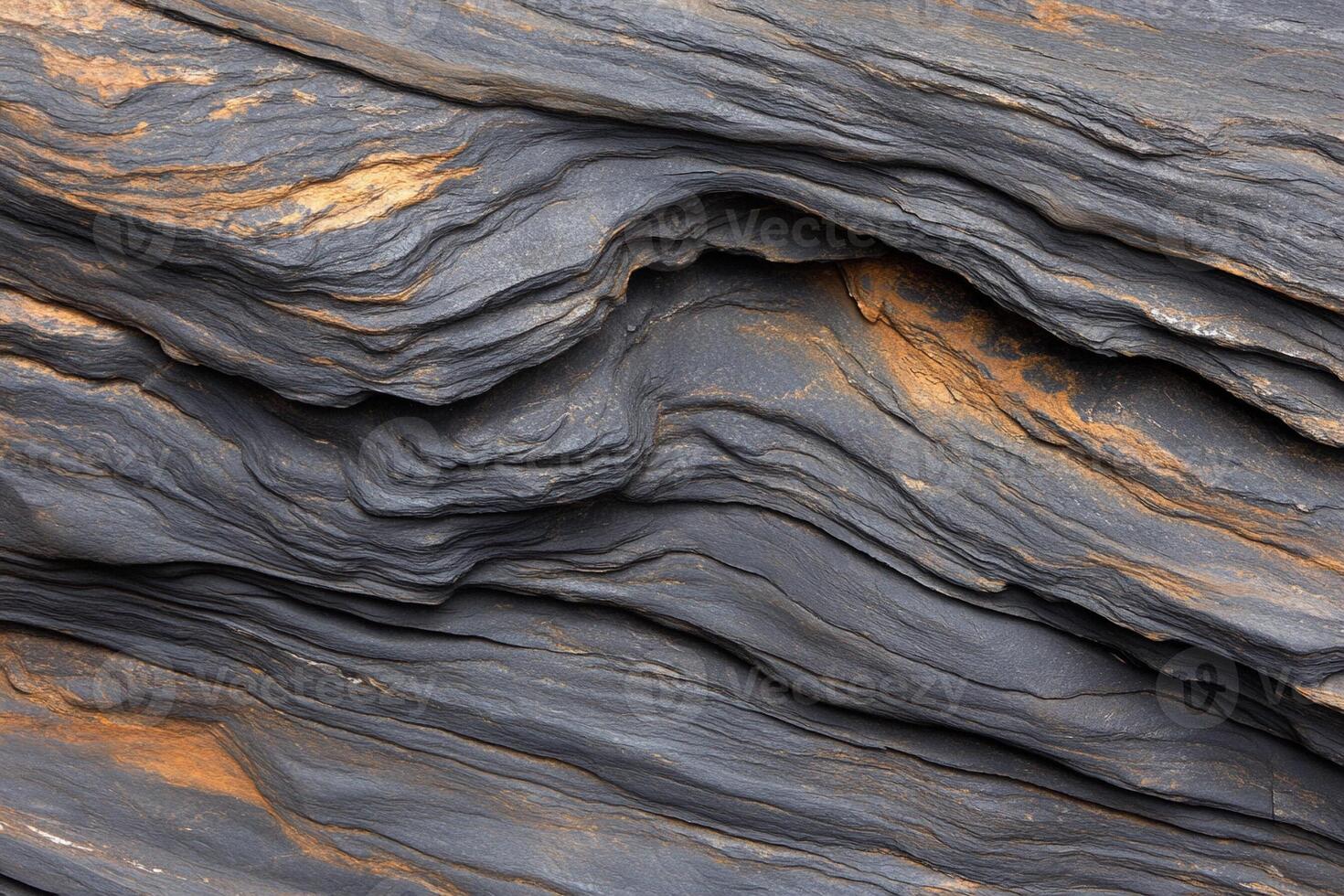 A close up of a rock wall with a lot of different colors photo