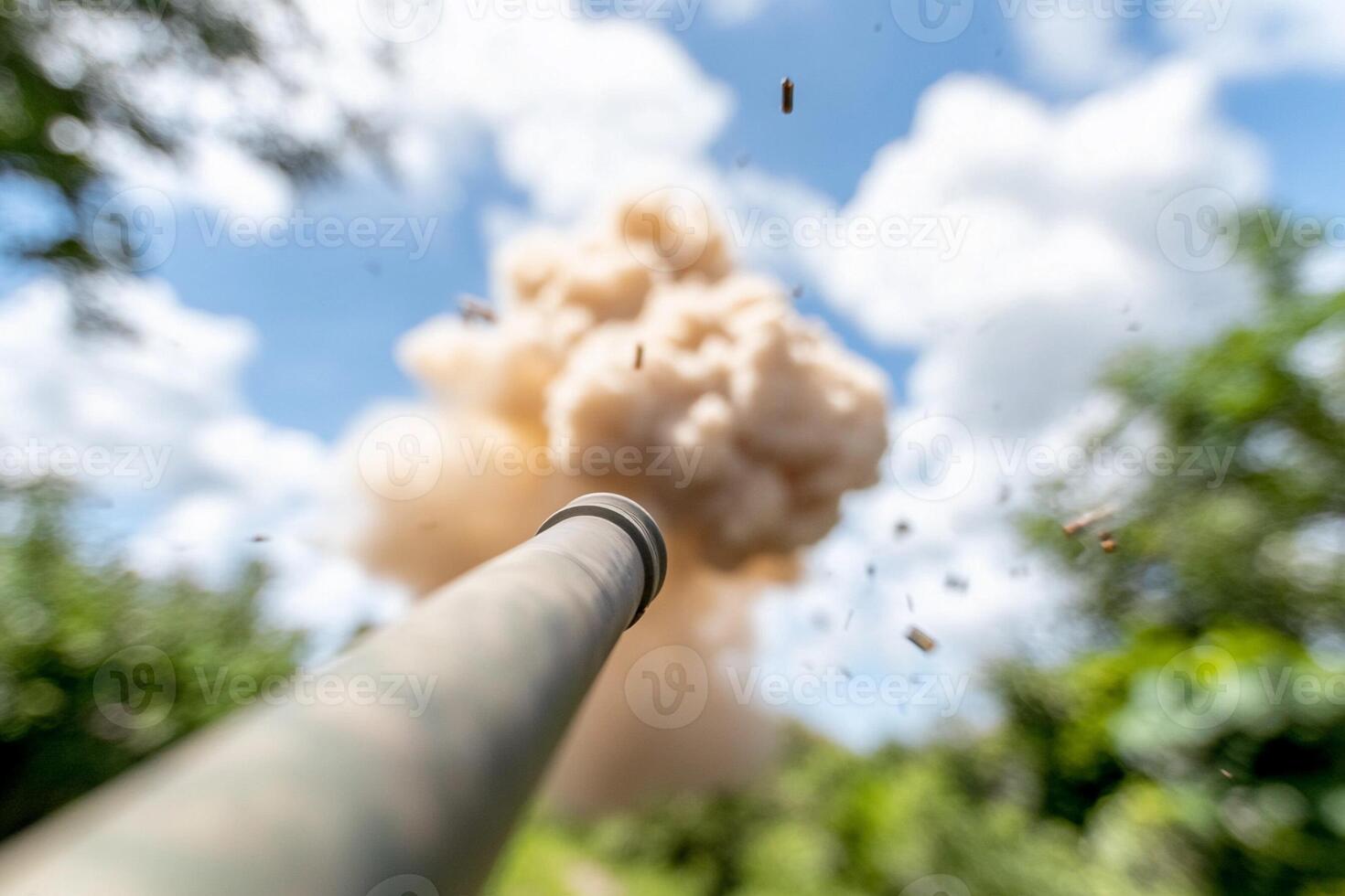 A close up of a gun being fired photo