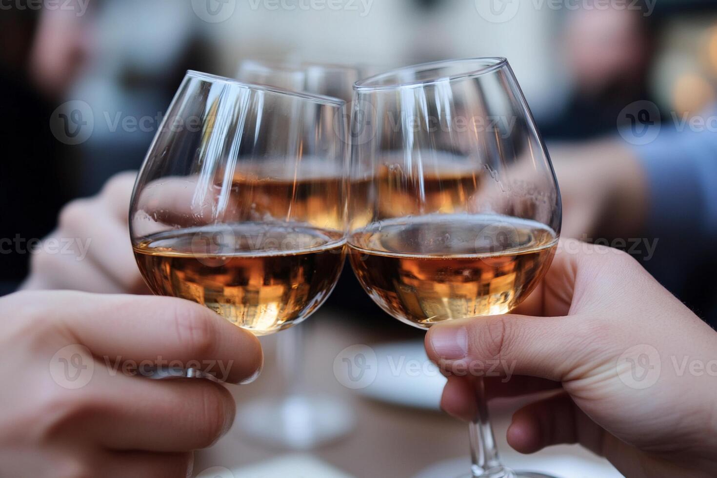 Two people toasting with wine glasses photo