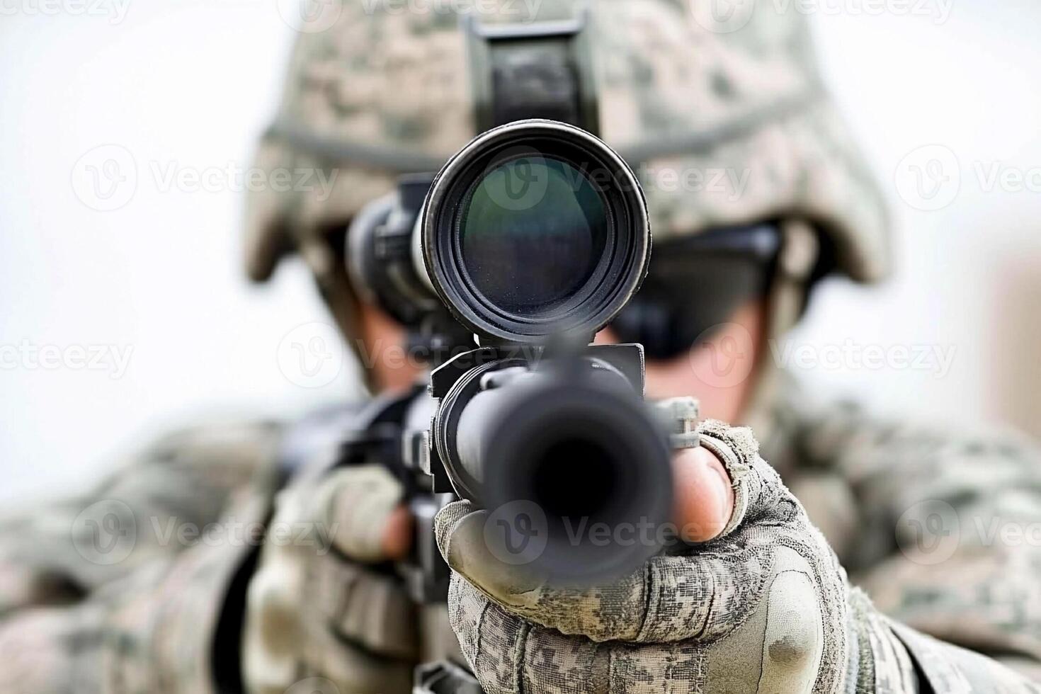 A soldier aiming with a rifle photo
