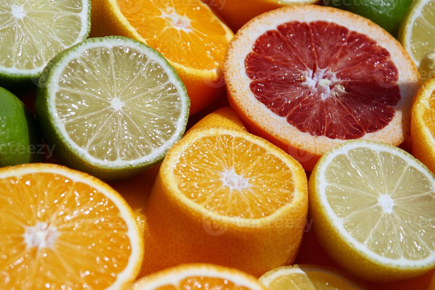 A close up of oranges and limes photo