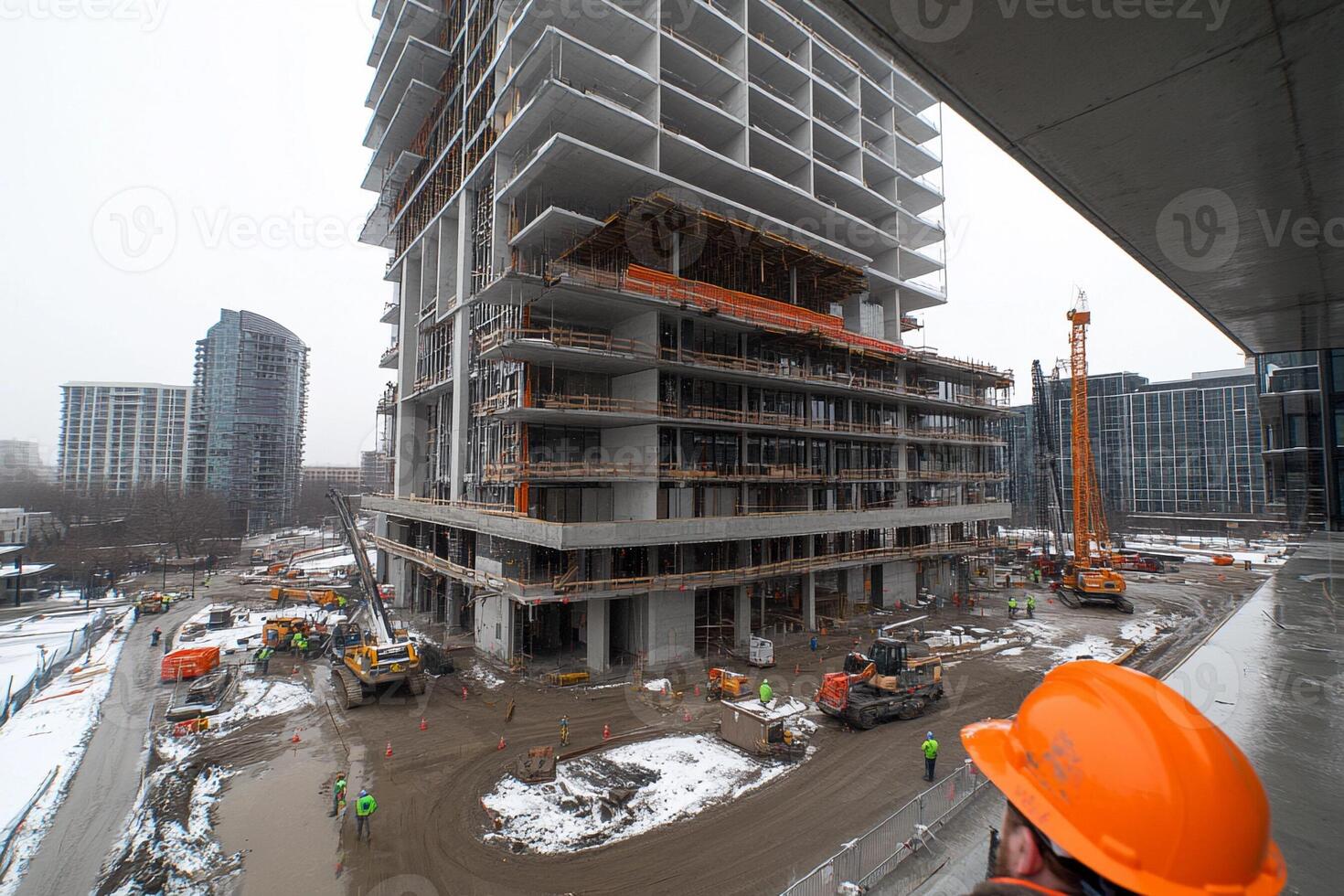 A construction worker is standing on a construction site photo