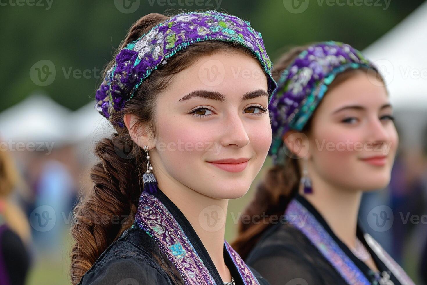 Two young women wearing headbands at a festival photo