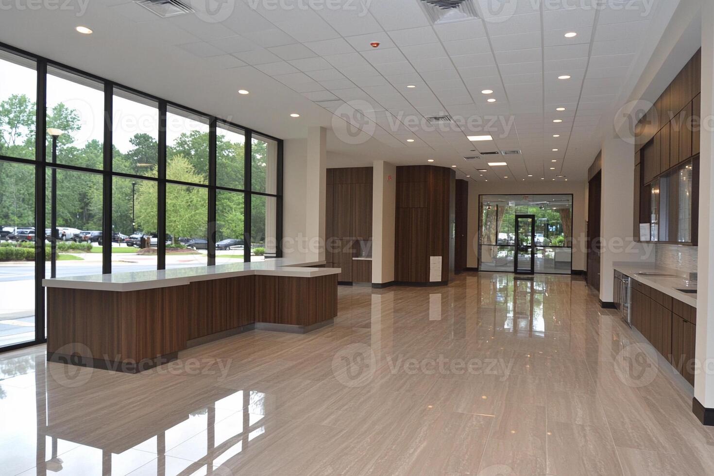 A large lobby with large windows and wood floors photo