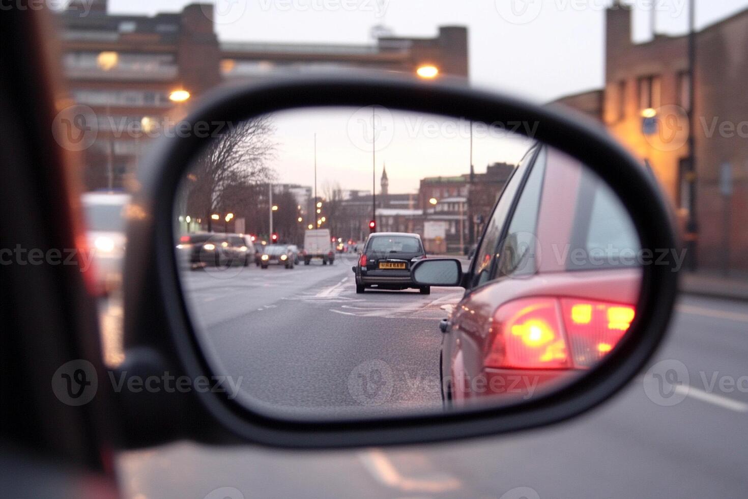 A car in the rear view mirror photo