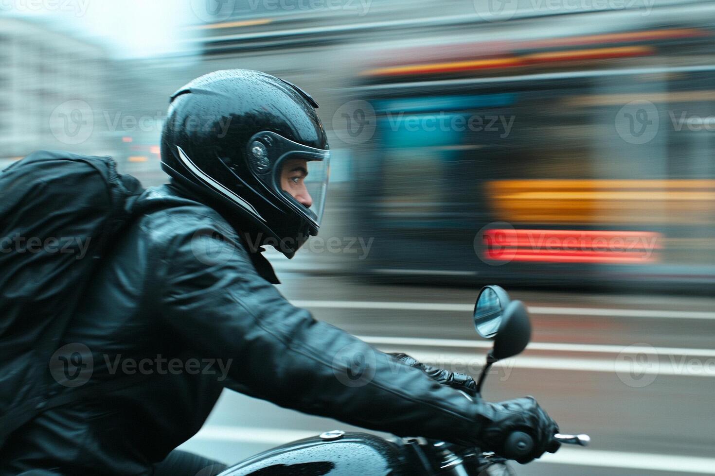 A man riding a motorcycle photo