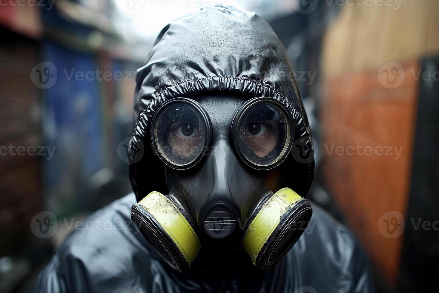 A man wearing a gas mask in an alley photo