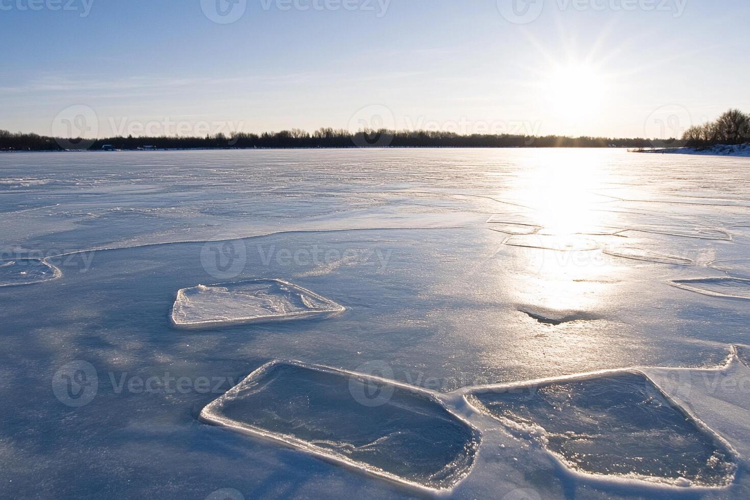Ice blocks on a frozen lake in the winter sun photo