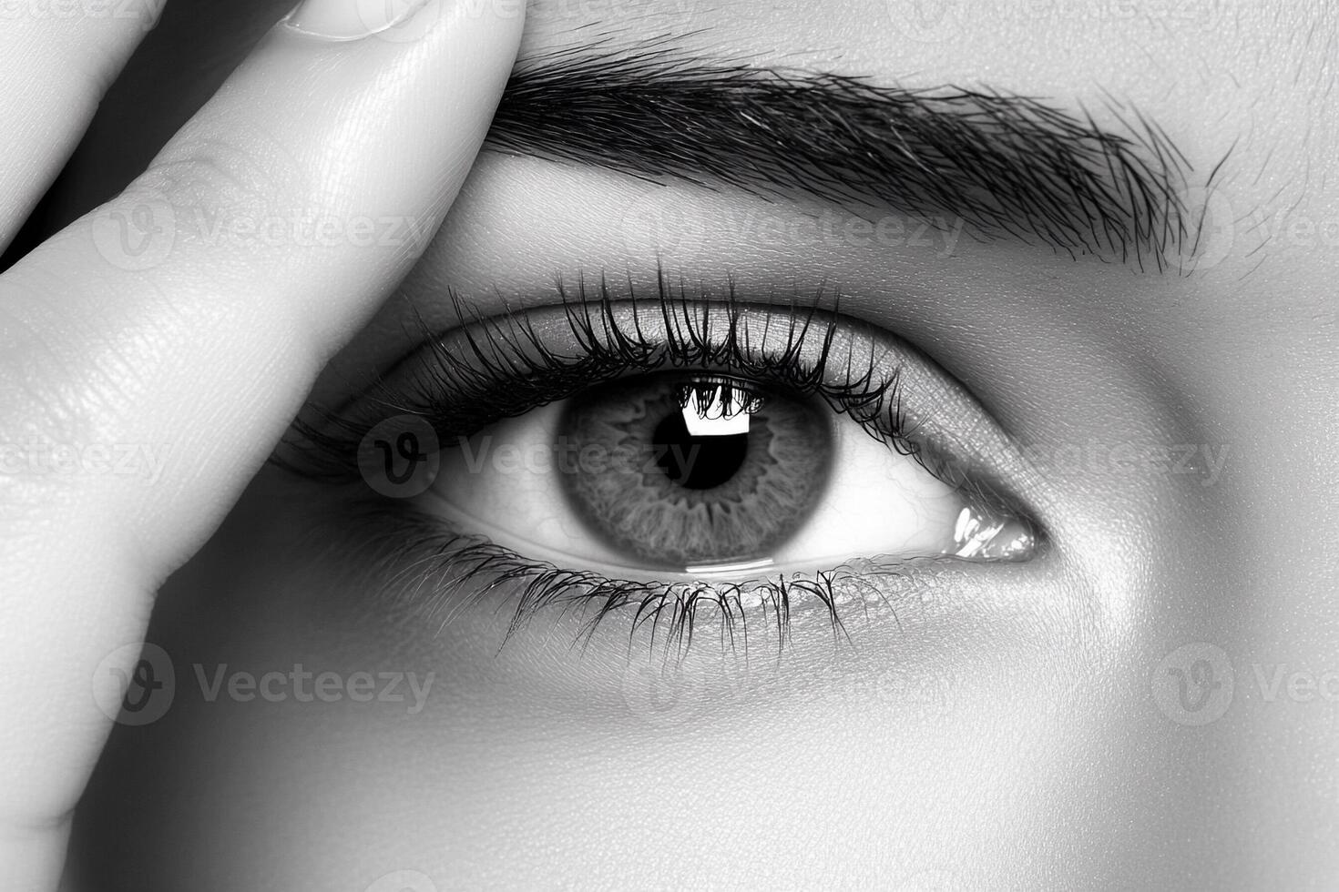A woman's eye with a black and white photo