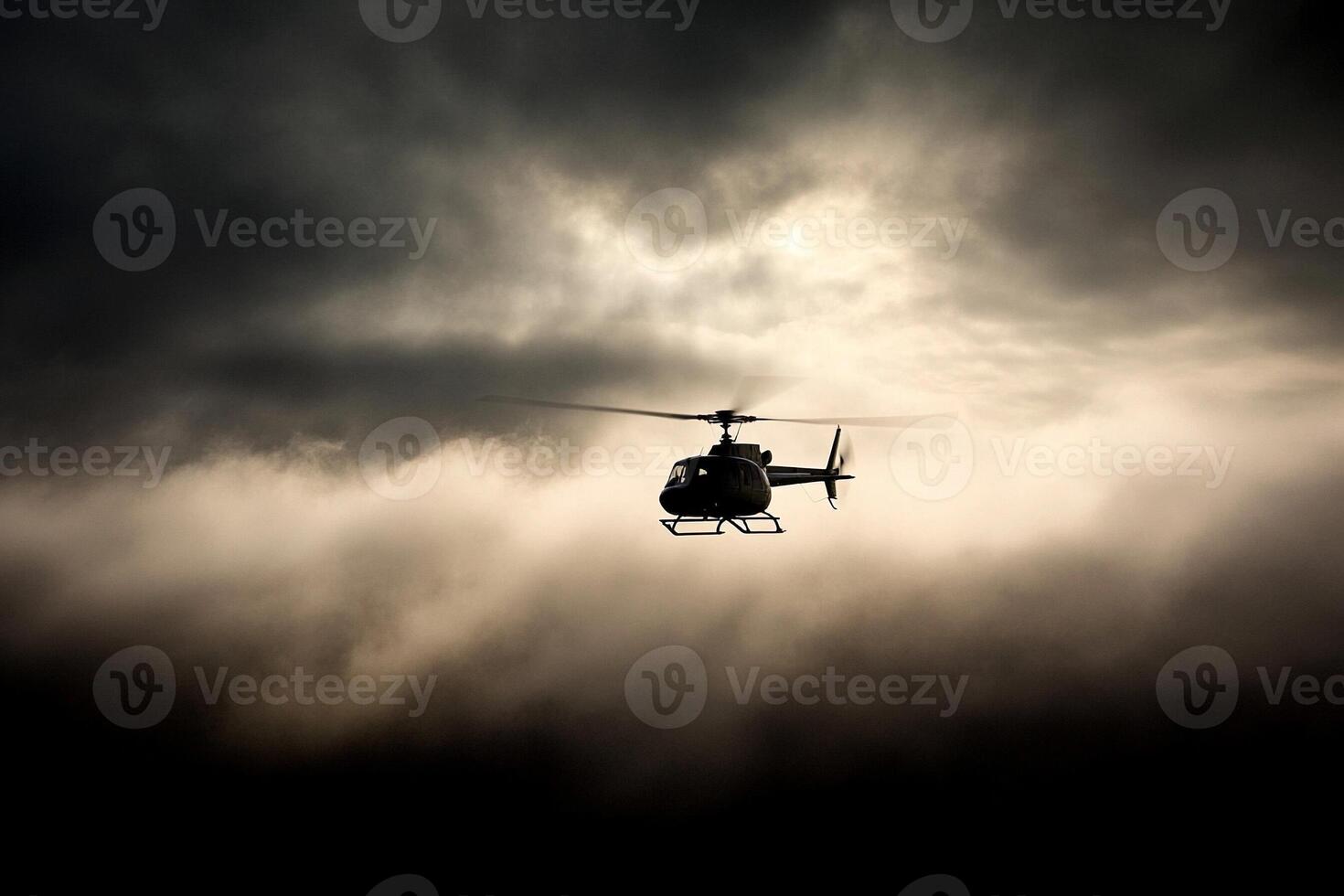 A helicopter flying through the clouds on a cloudy day photo