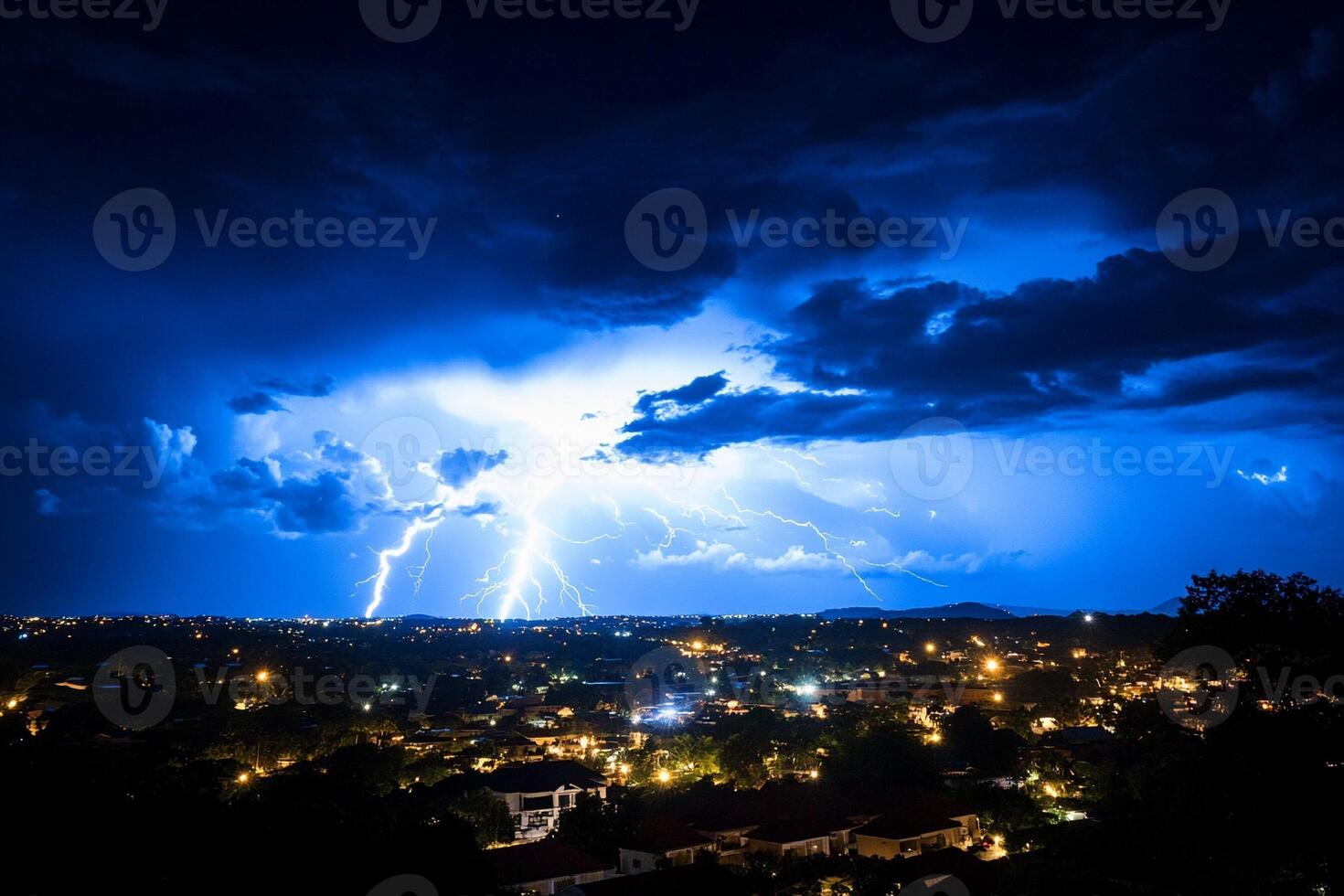 Lightning strikes over a city at night photo