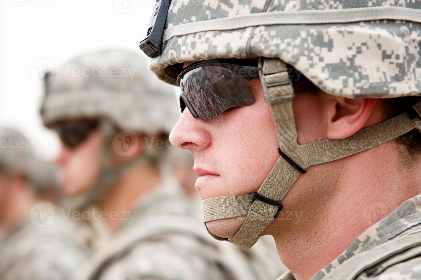 A soldier in uniform with sunglasses on his face photo