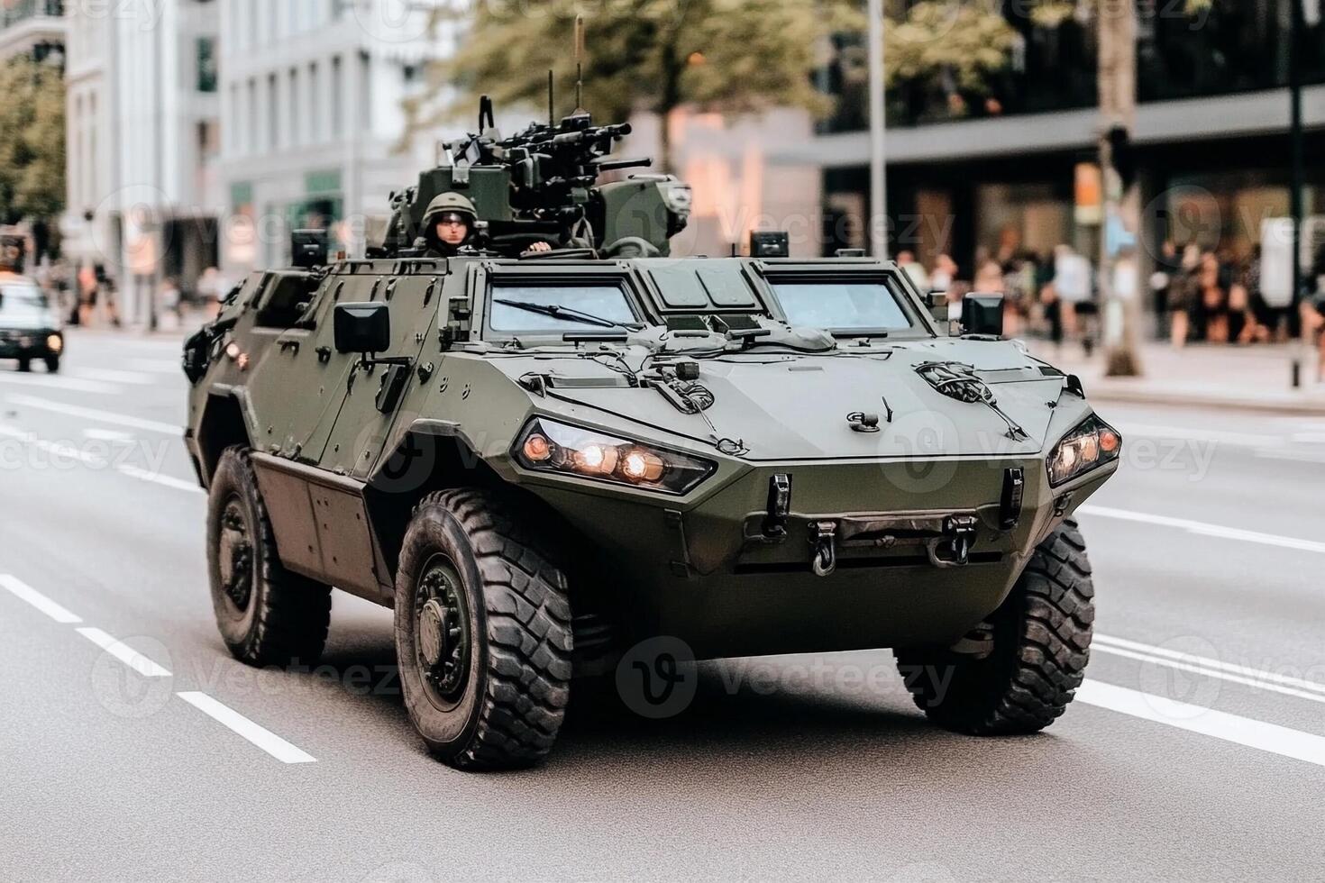 A military vehicle driving down the street photo