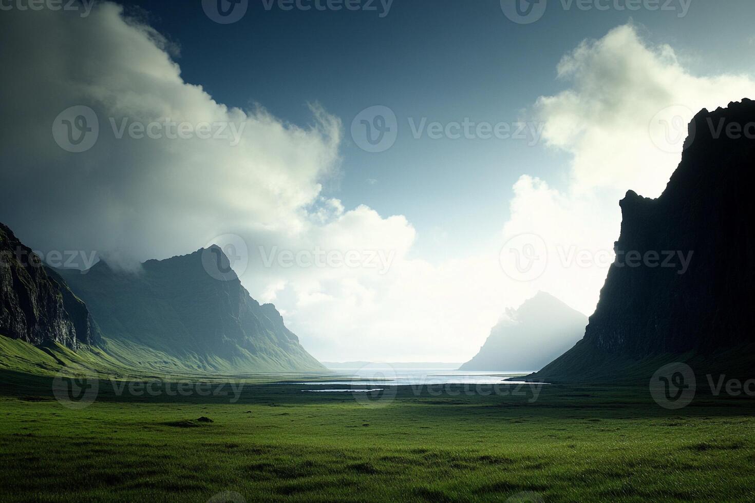 A grassy field with mountains in the background photo