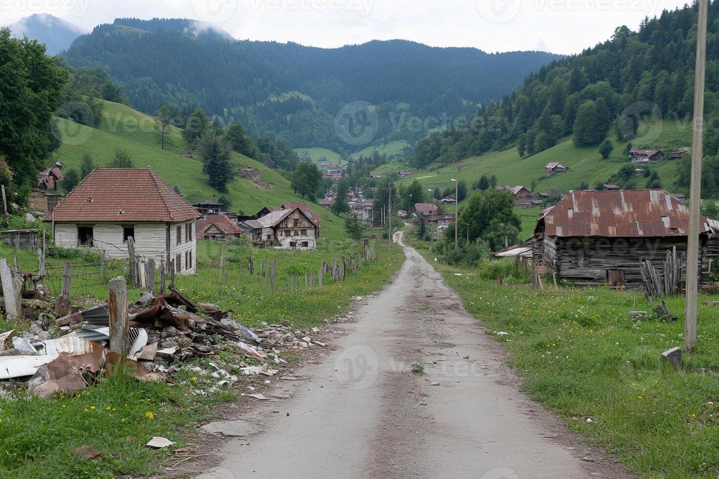A dirt road with houses on it photo