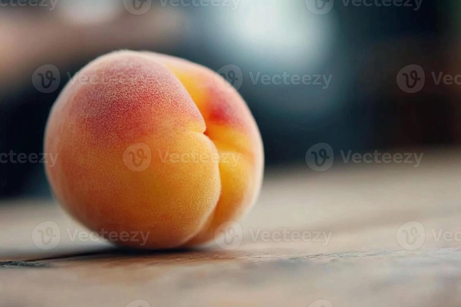 A peach on a wooden table photo