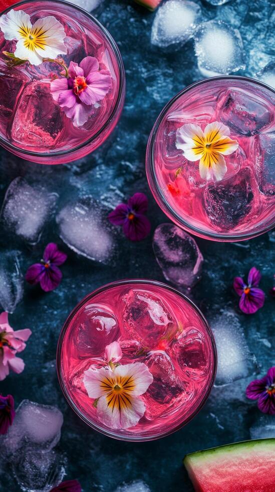 Floral Infusion Refreshing Pink Cocktails with Ice Cubes and Delicate Flowers, a Sweet Summer Indulgence for a Tropical Vacation, Close-Up photo