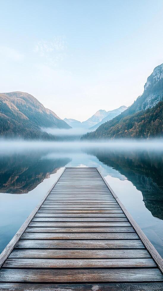 Serene Lake Landscape Misty Mountains and Wooden Pier Reflection - A Tranquil Escape into Nature's Beauty for Travel and Relaxation photo