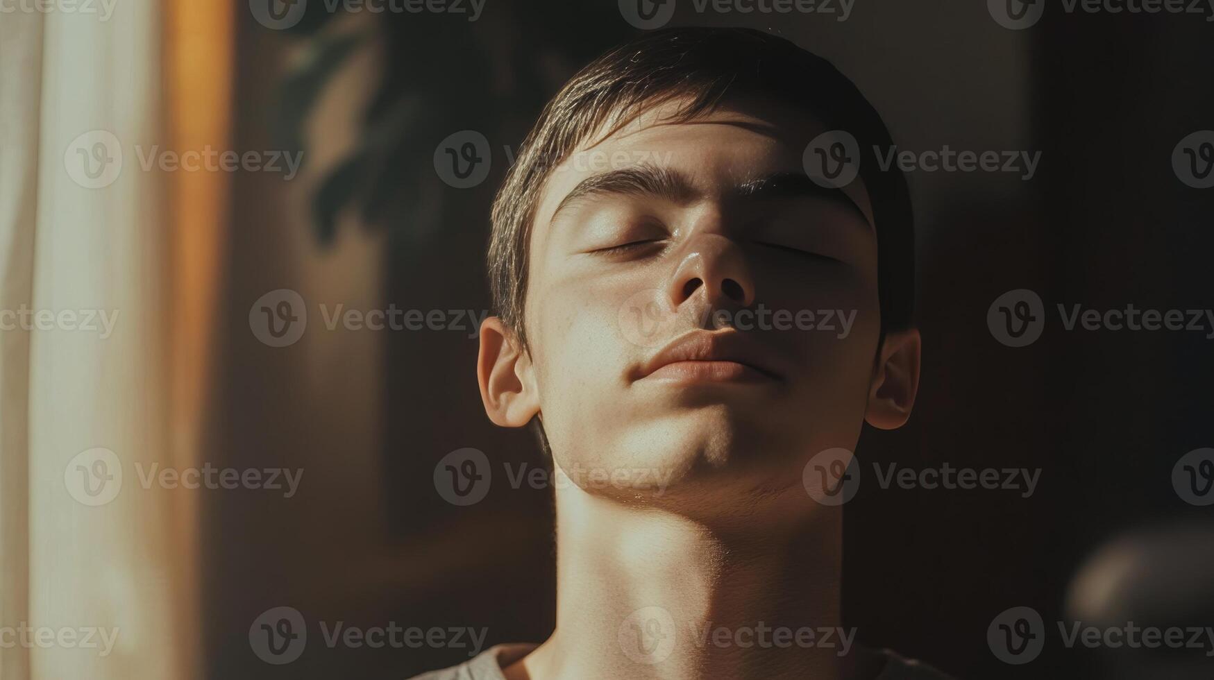 A Peaceful Moment Captured A Young Man's Tranquil Portrait photo