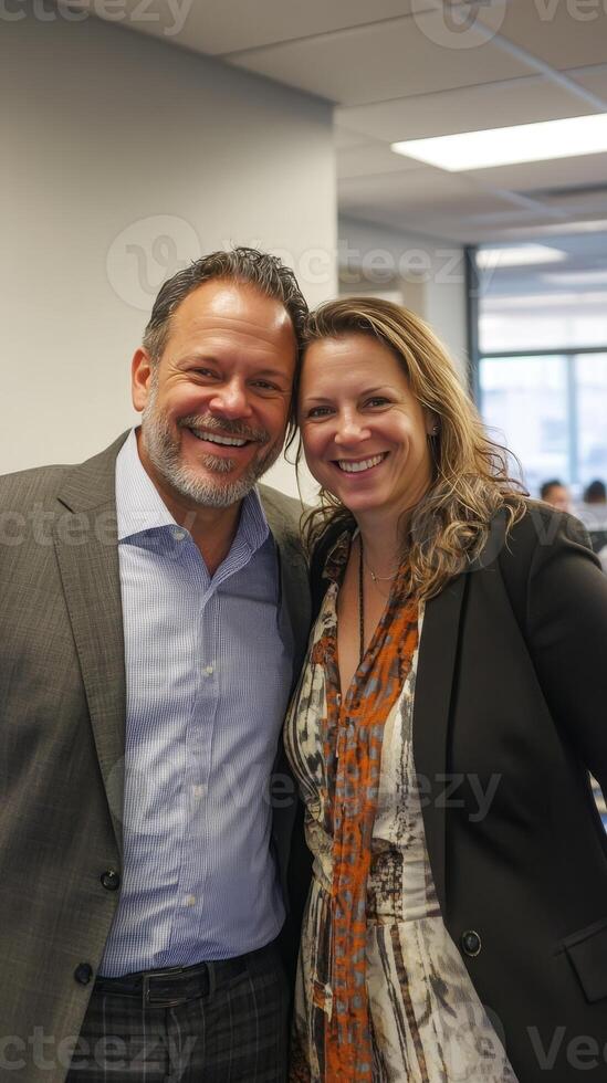 Smiling Business Couple at a Corporate Event photo