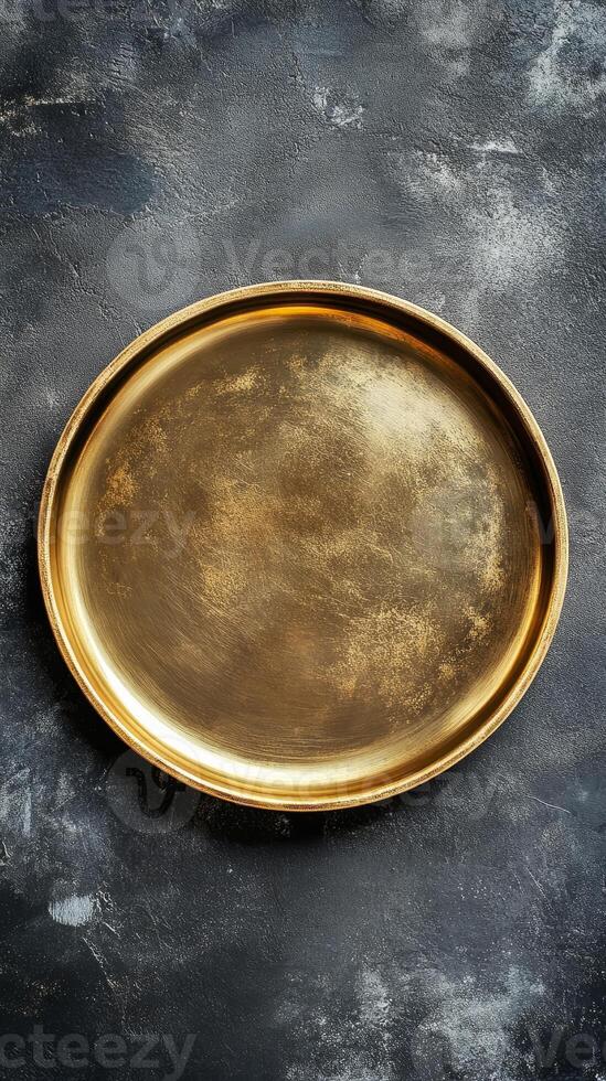 Elegant Golden Tray on Dark Textured Background - A Versatile Graphic Resource for Design, Decoration, and Artistic Projects, Offering a Touch of Vintage Charm photo