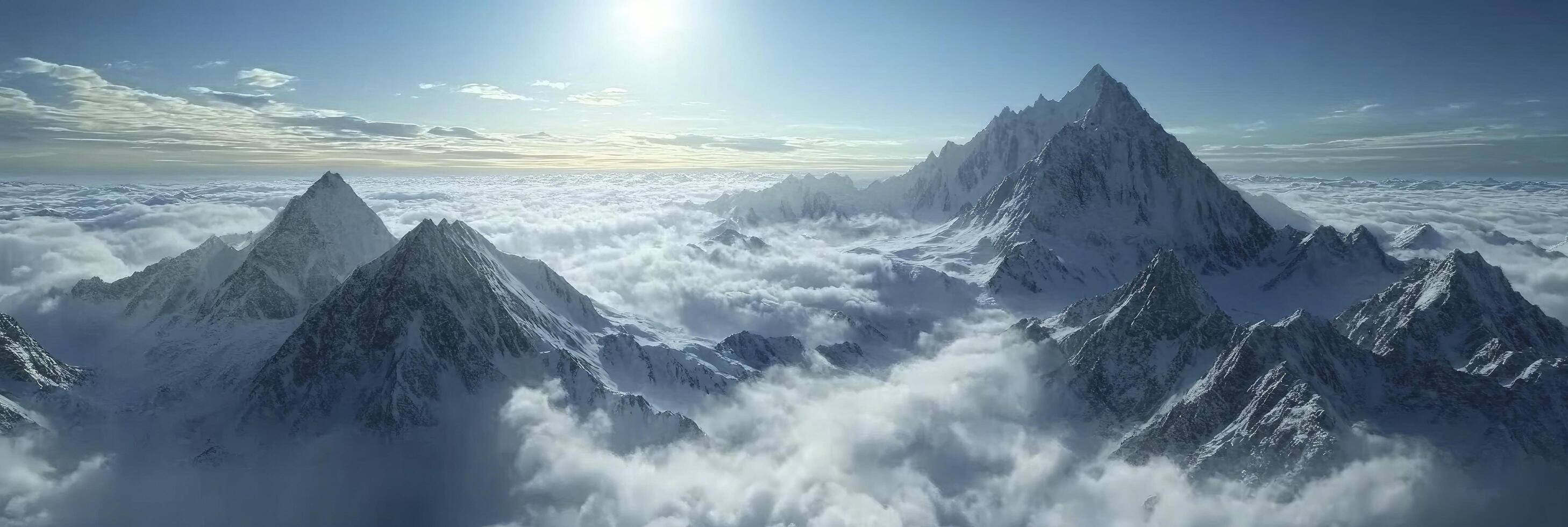 A mountain range is seen above the clouds photo