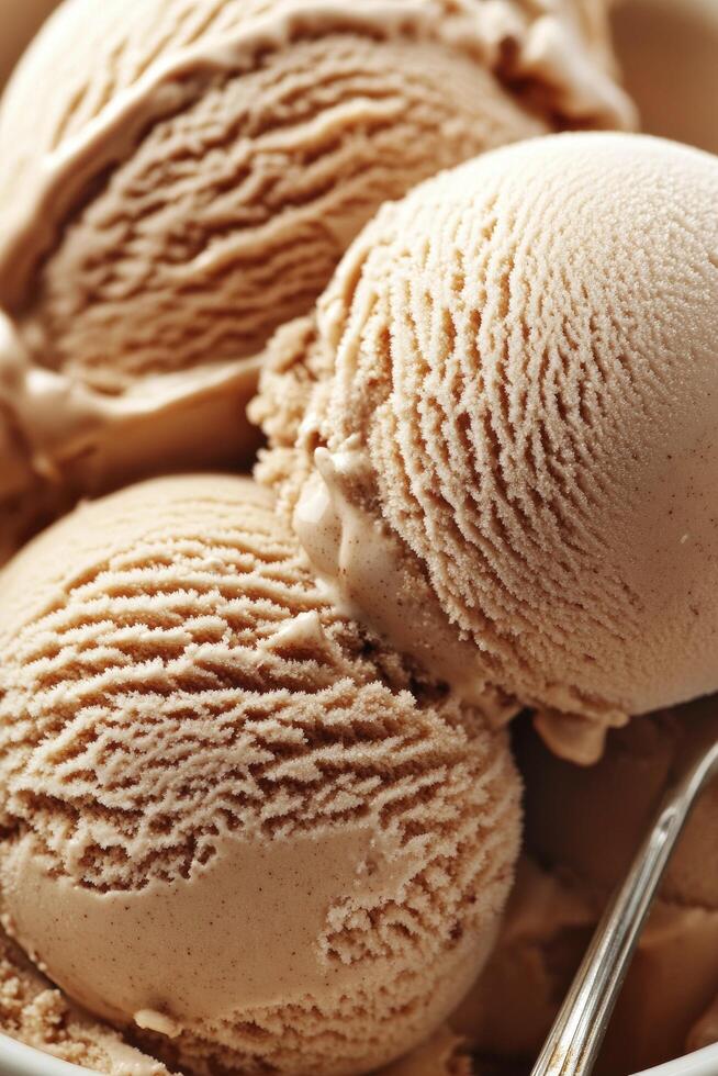 A bowl of ice cream with a spoon photo
