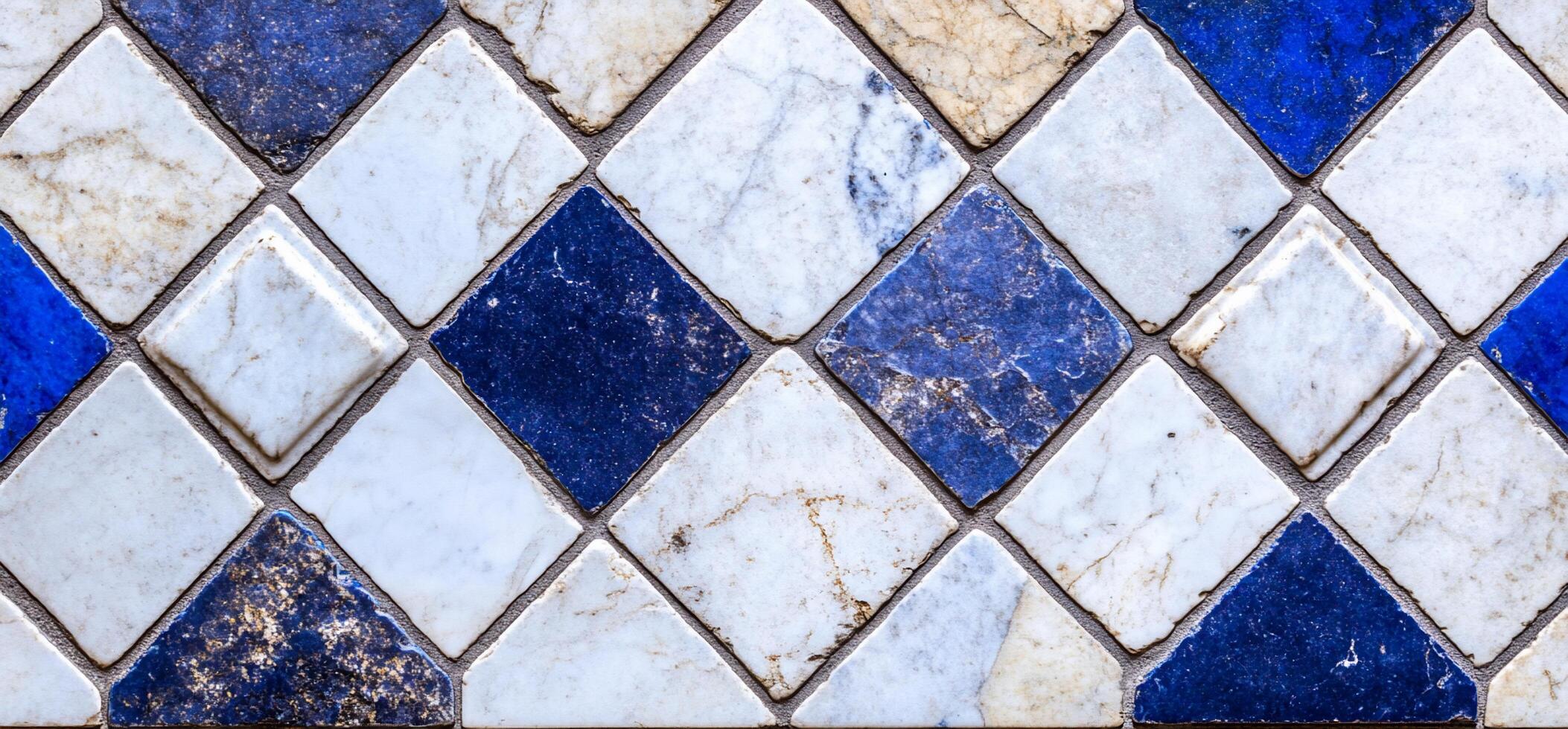 A decorative tile pattern featuring blue and white diamond shapes. photo