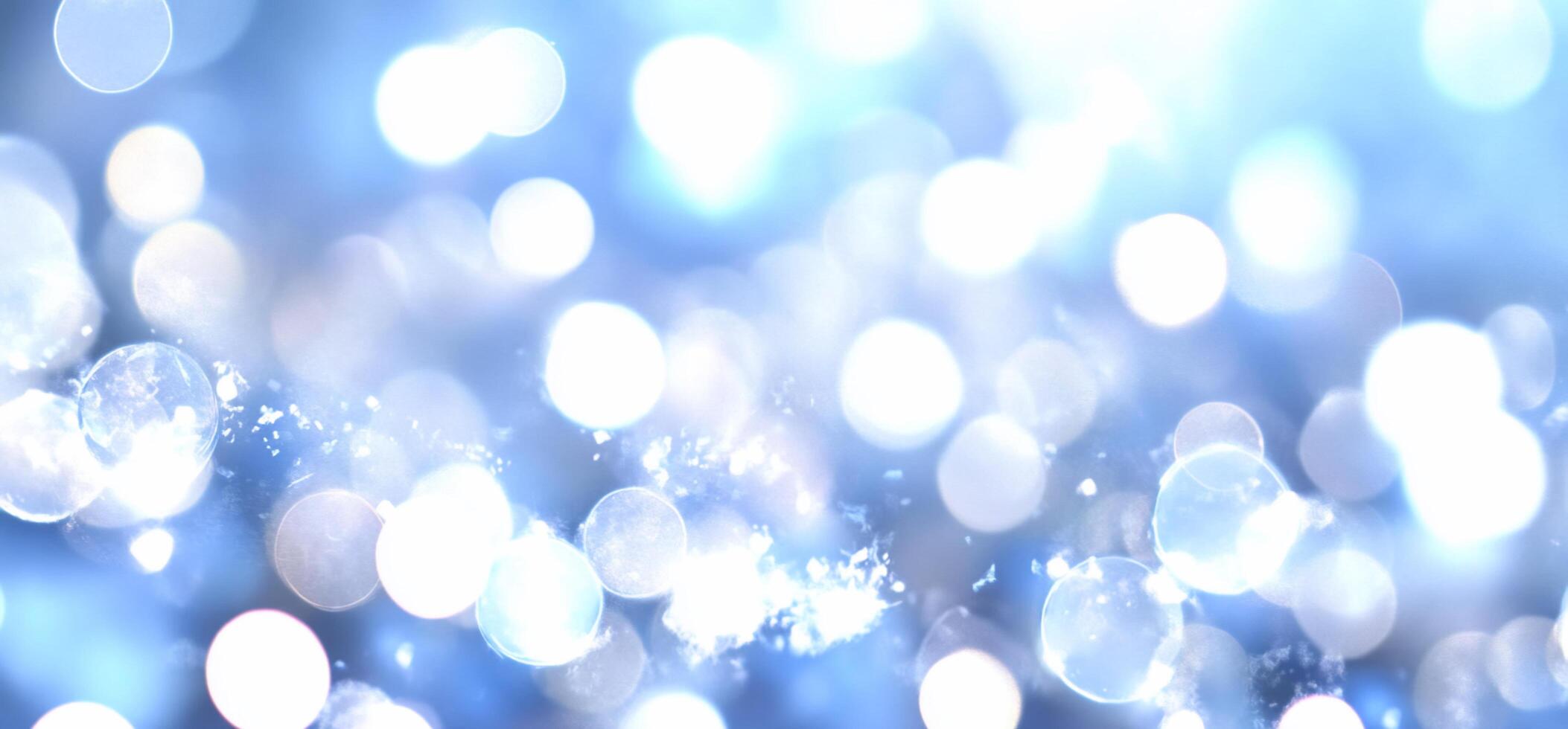 A soft blue bokeh background with shimmering light effects. photo