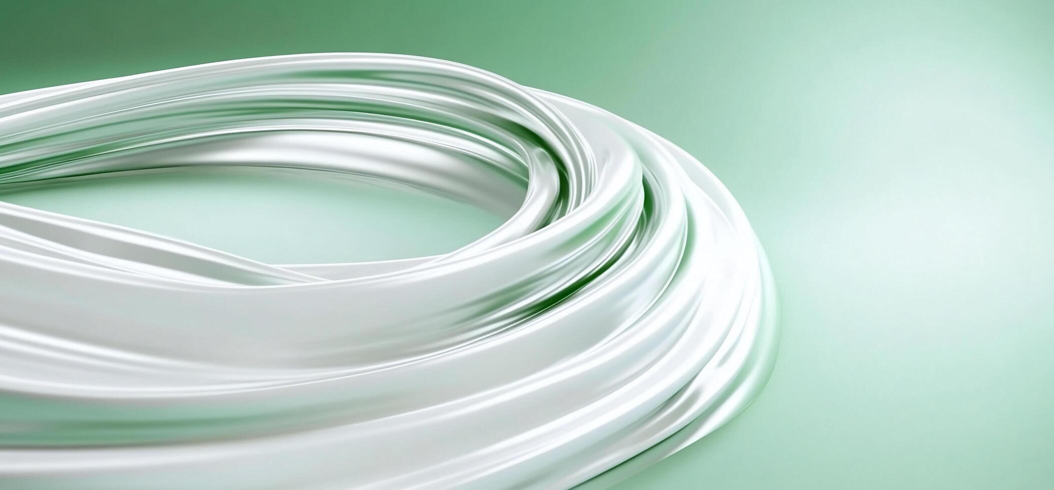 A coiled white cable against a soft green background. photo