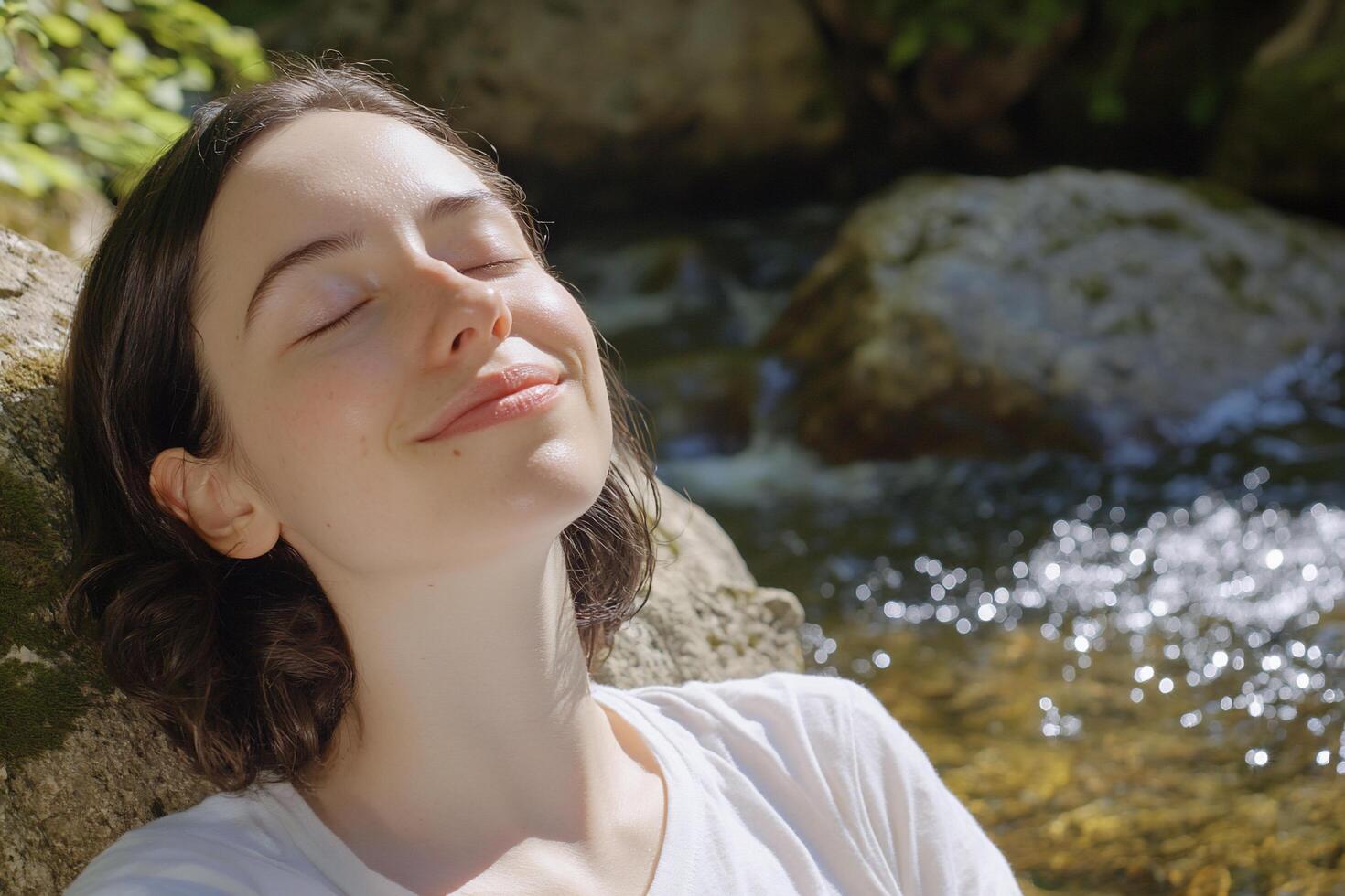 A woman is relaxing by a stream photo