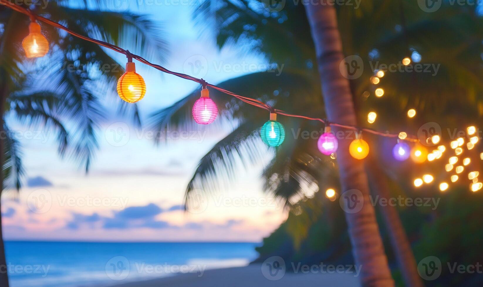 Christmas lights on a beach at sunset photo