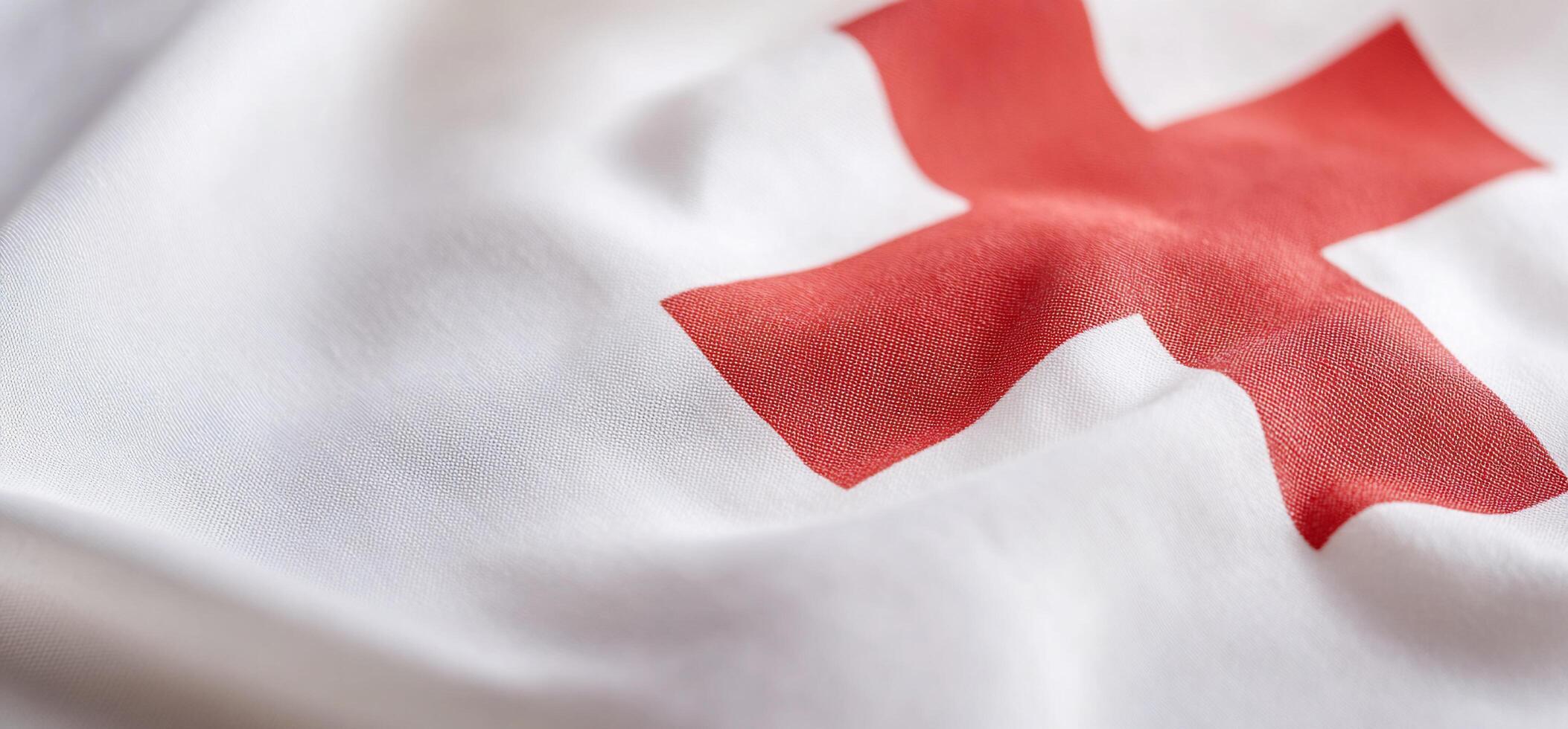 A red cross on a white t - shirt photo