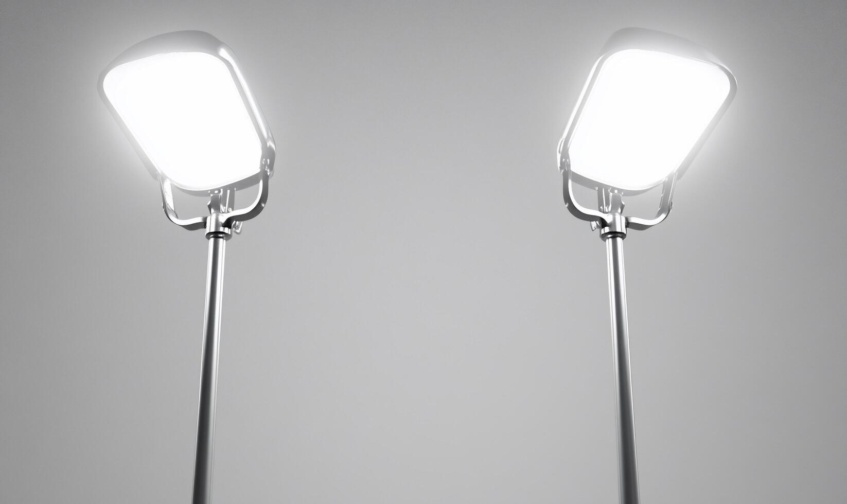 Two lamps on a gray background with one light on each side photo