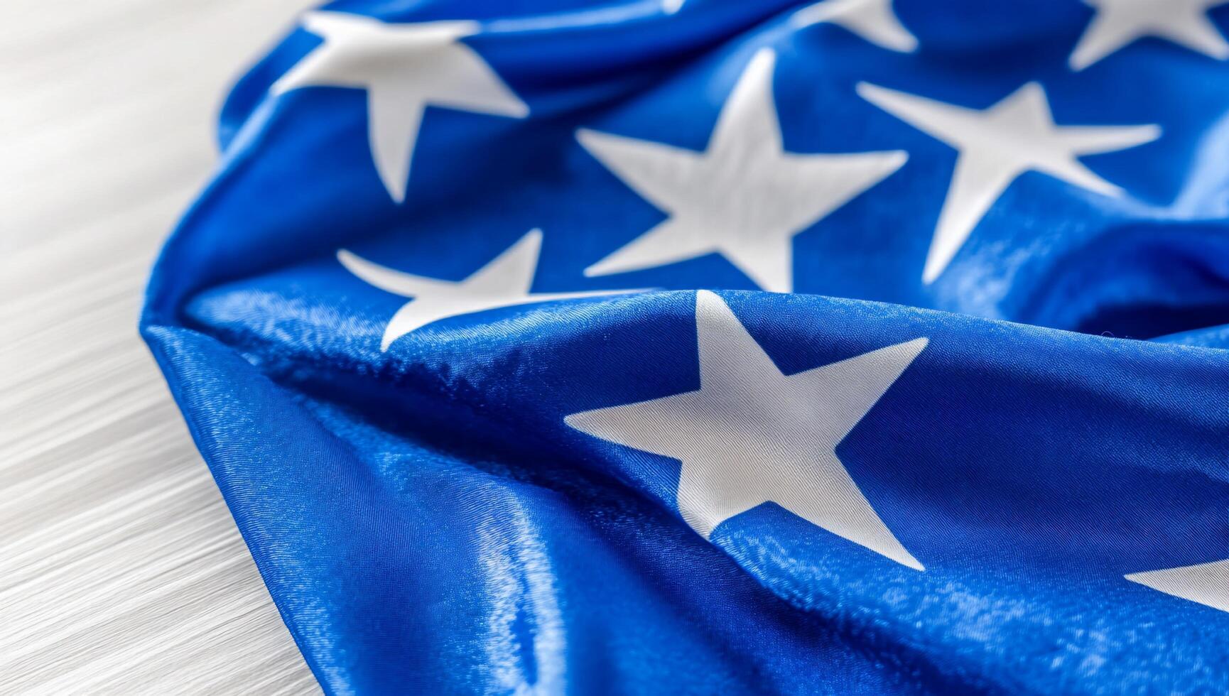A close-up of a blue fabric with white stars, symbolizing patriotism. photo
