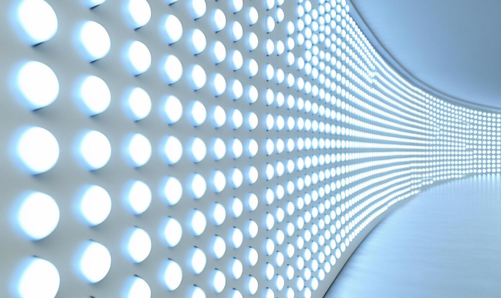A curved wall illuminated by bright, circular lights in a modern space. photo