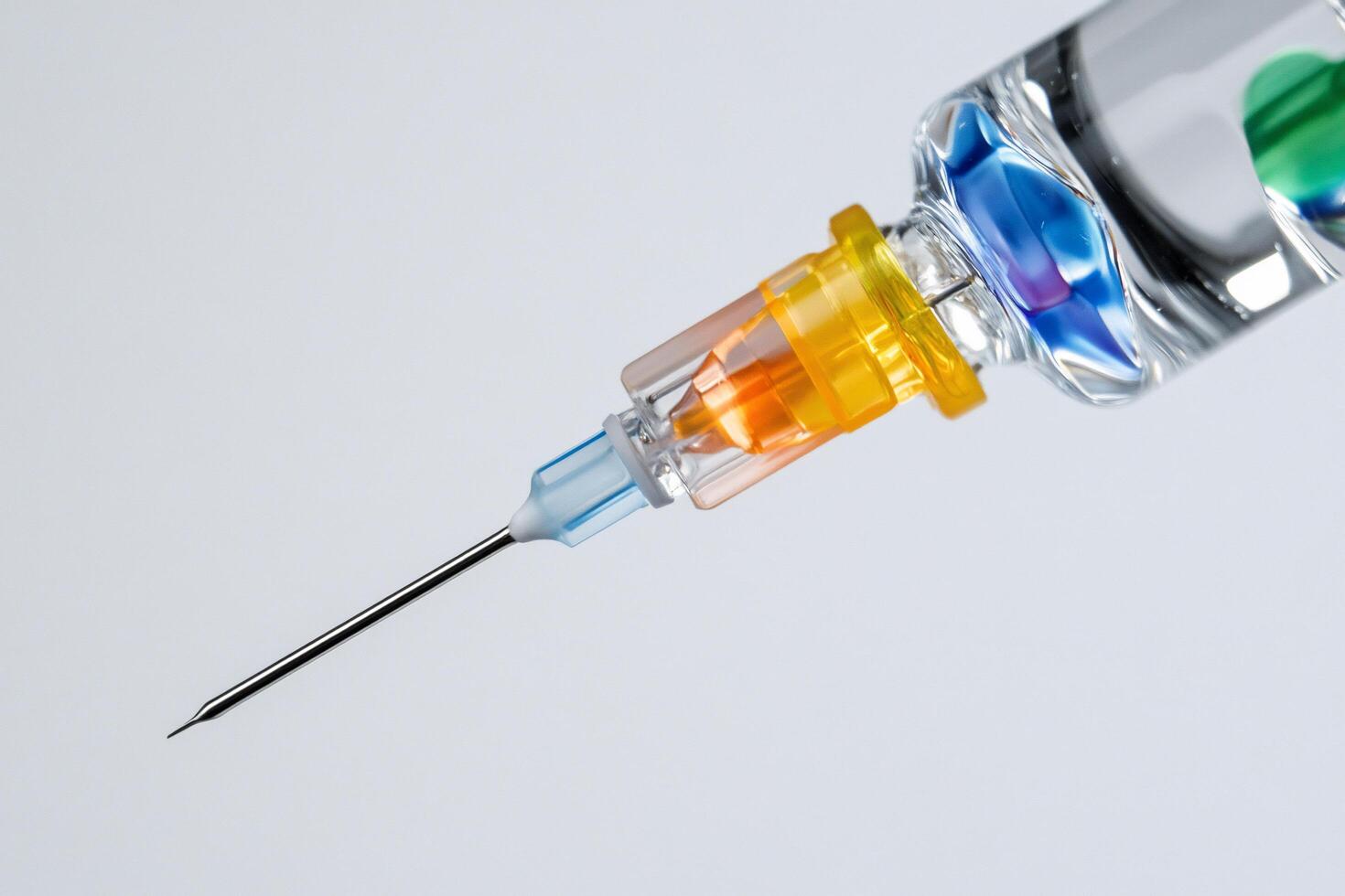 A close-up of a syringe and vial, illustrating medical use. photo