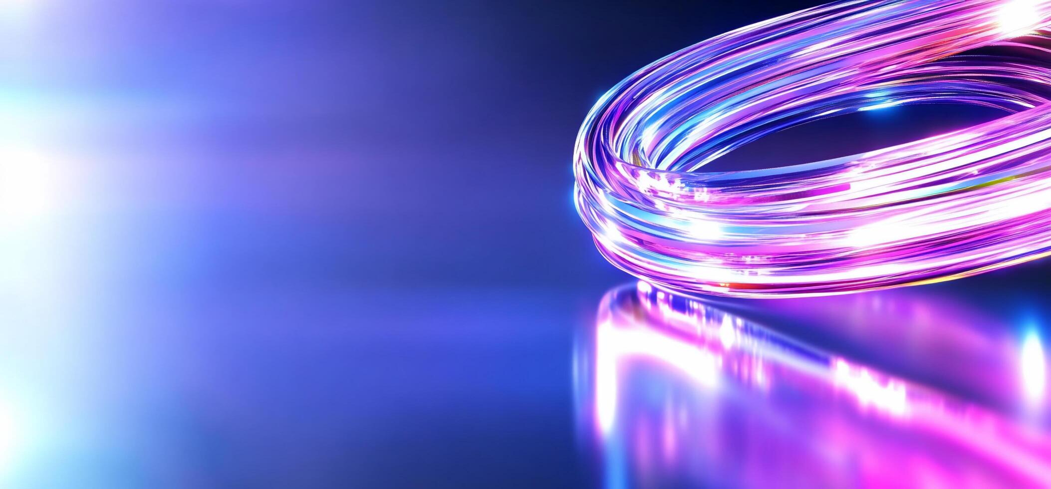 A vibrant, glowing cable with reflections on a smooth surface. photo
