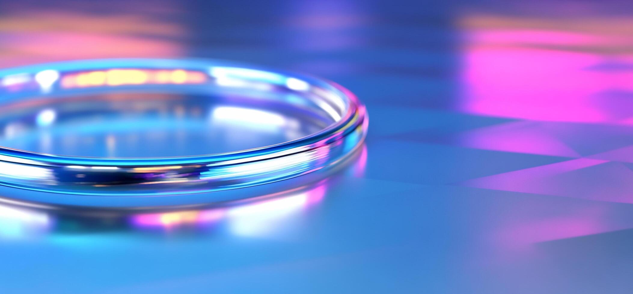 A close-up of a glass ring on a colorful, reflective surface. photo