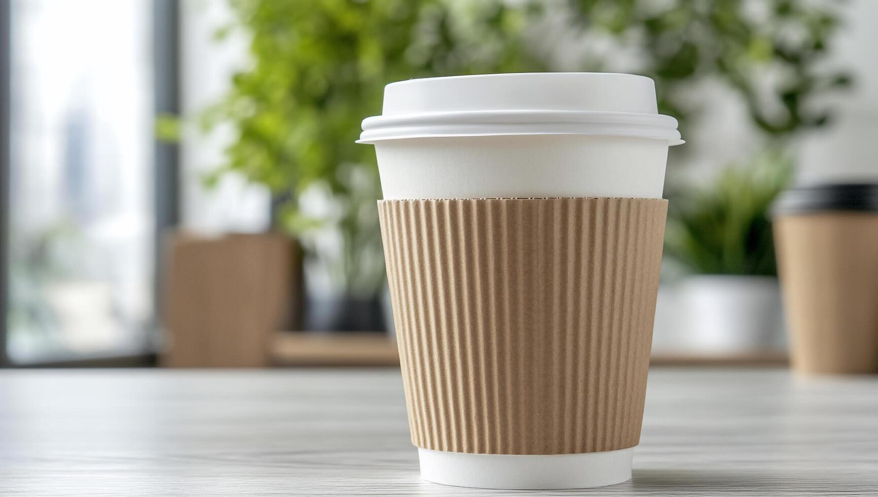 A takeaway coffee cup on a wooden table with greenery in the background. photo