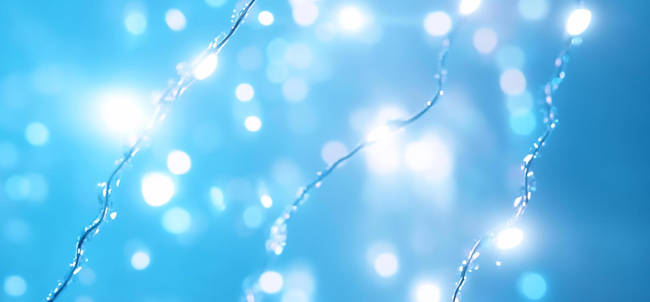 Abstract blue background with shimmering lights and flowing lines. photo