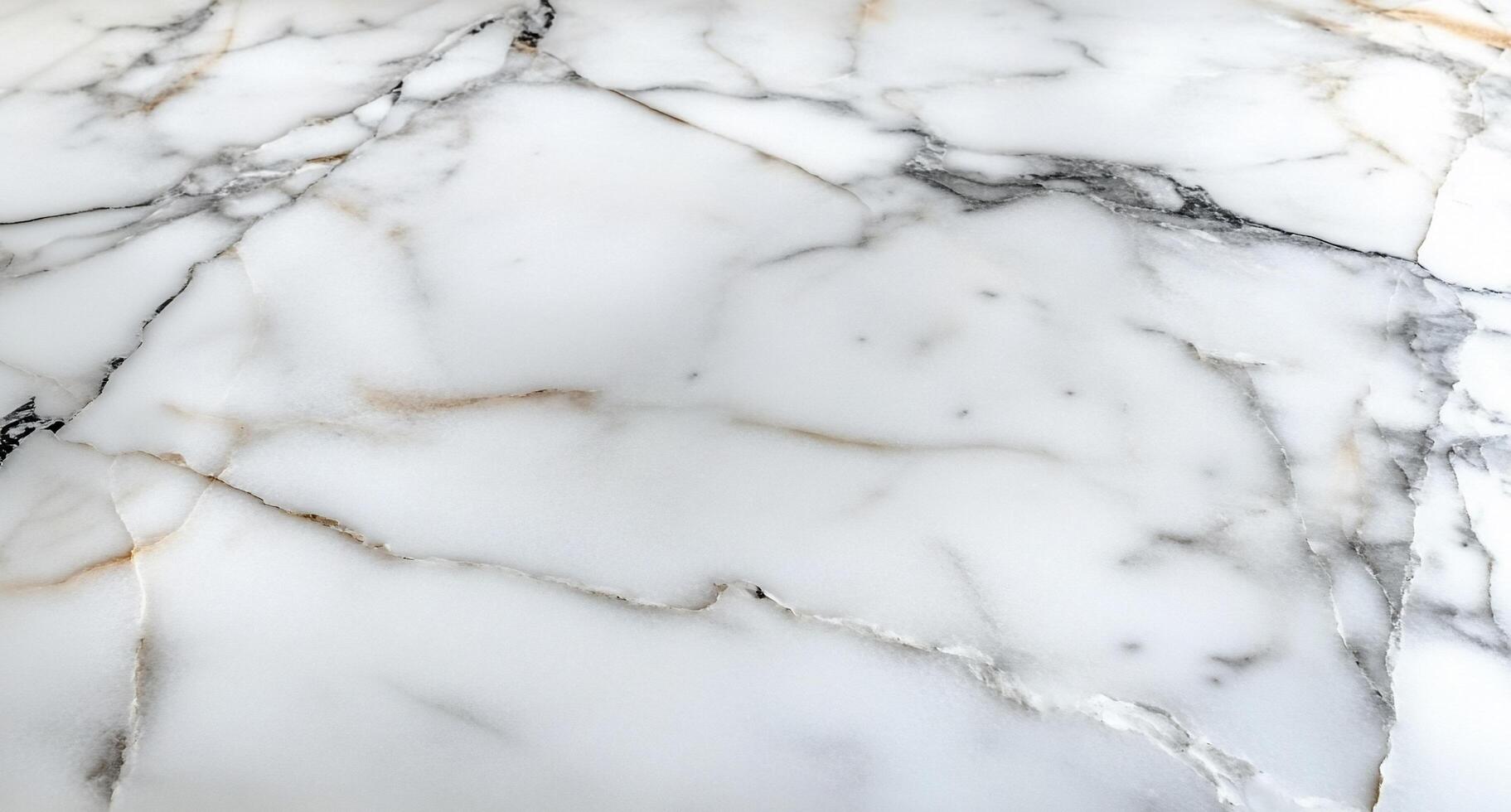 Smooth white marble surface with gray and gold veining patterns. photo