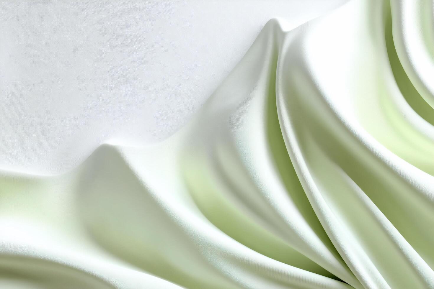Soft, flowing fabric in light green and white tones. photo