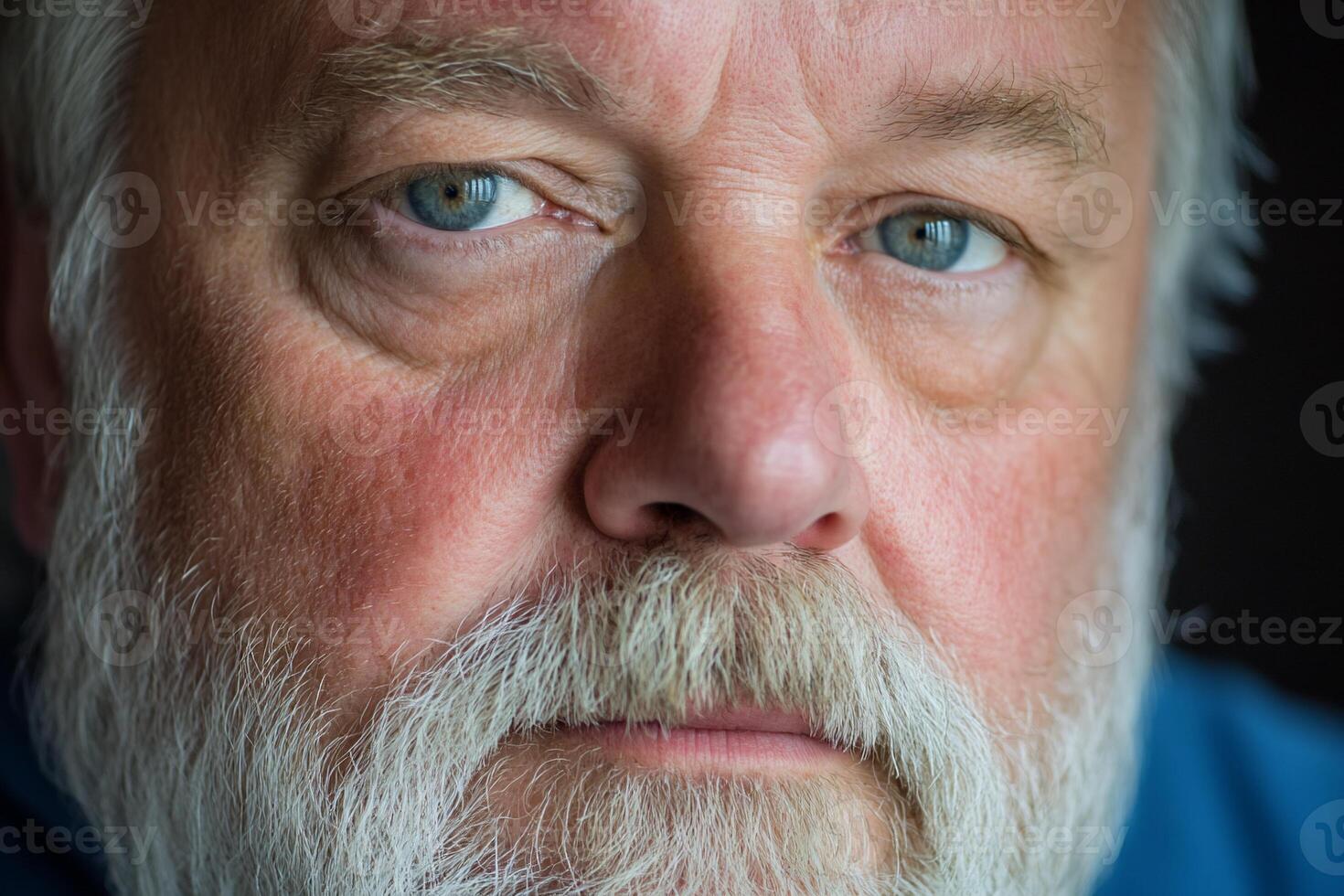 A close up of a man with a white beard photo