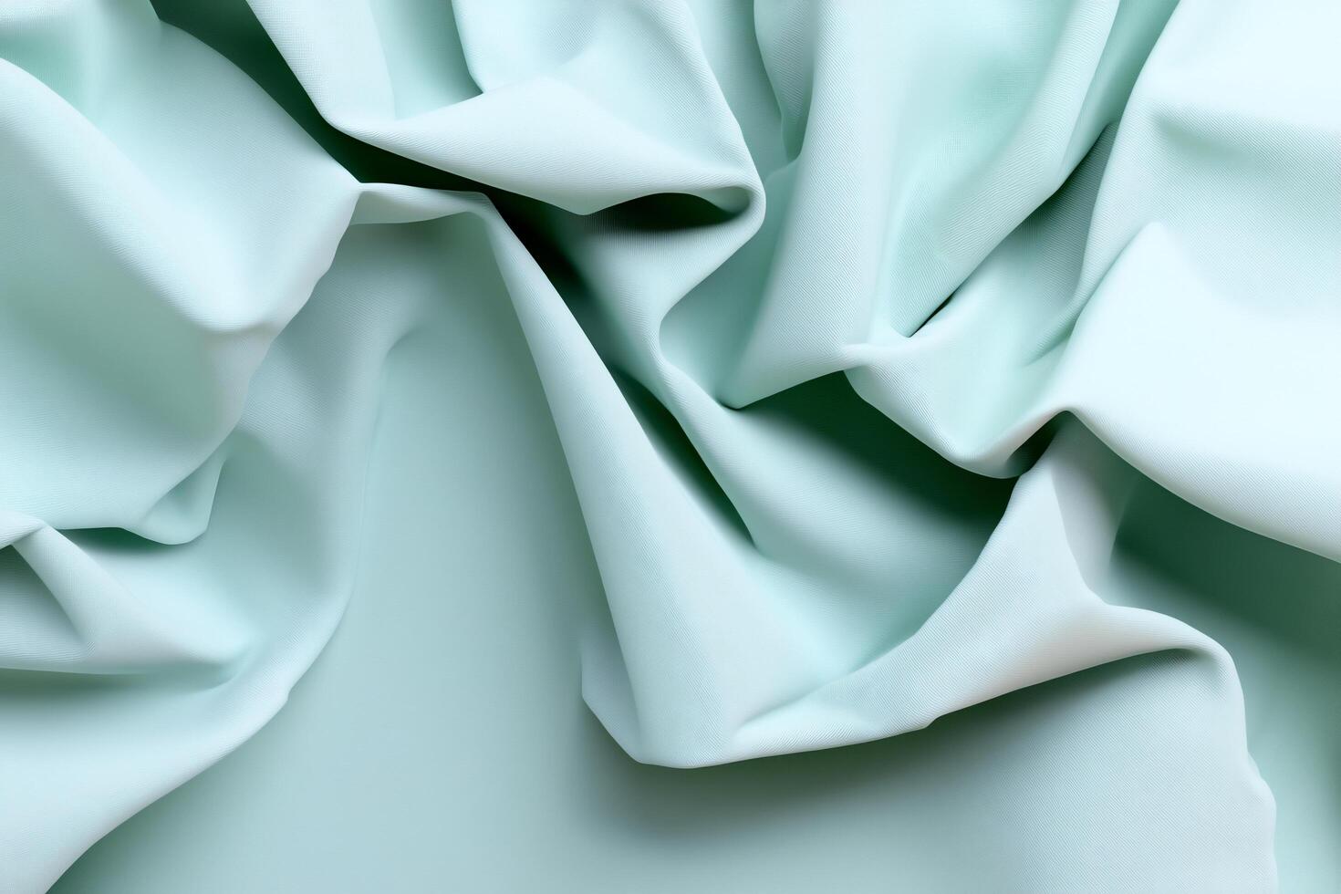A close-up of soft, crumpled mint-colored fabric. photo