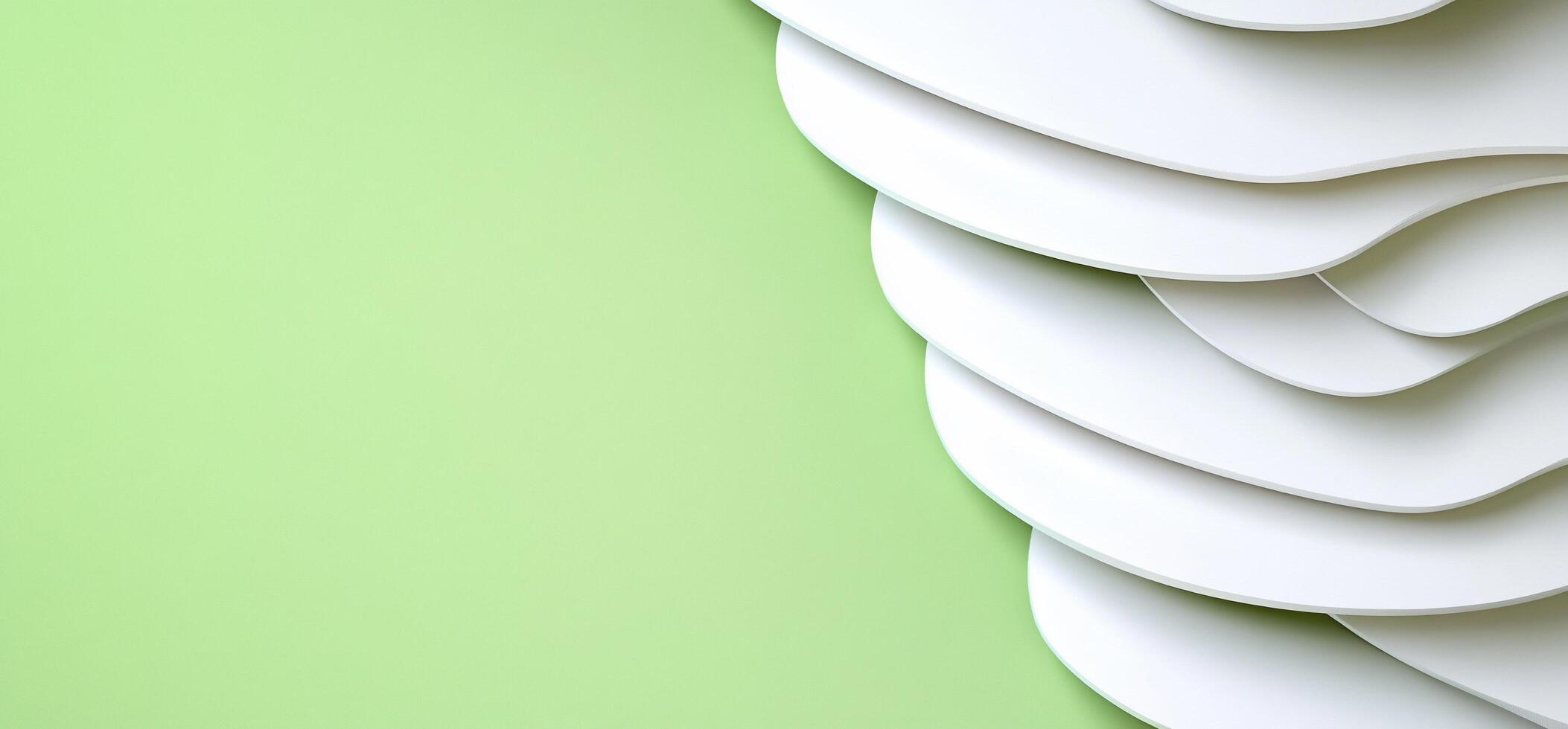 Abstract design with layered white shapes on a soft green background. photo